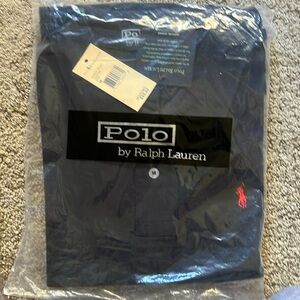 Ralph Lauren polo shirt medium 
New with tags never worn, blue red emblem